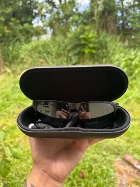 Oakleys Black Shield-Style Sunglasses with Case